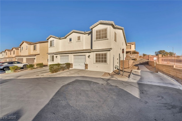 townhome / multi-family property featuring a garage