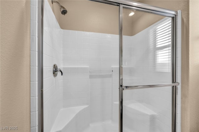 bathroom featuring an enclosed shower