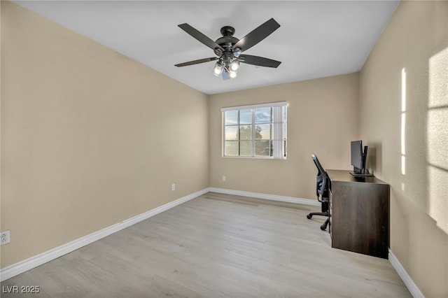 unfurnished office featuring ceiling fan and light hardwood / wood-style flooring