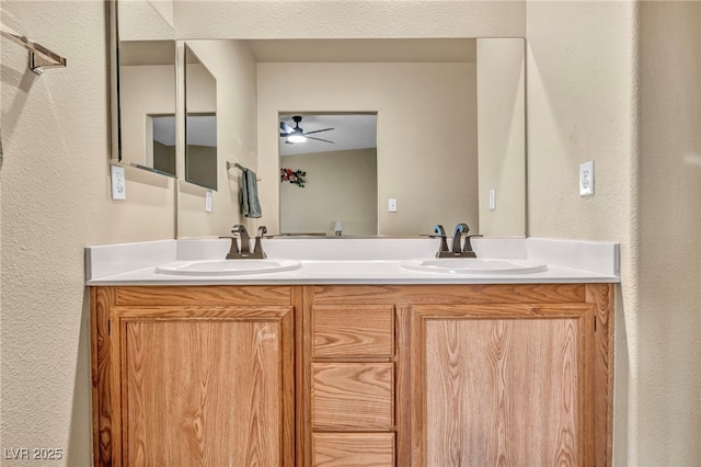 bathroom featuring ceiling fan and vanity