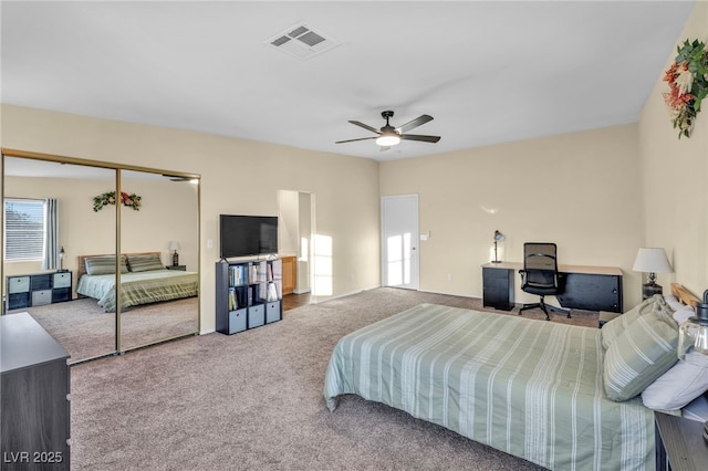 bedroom featuring ceiling fan, carpet flooring, and a closet