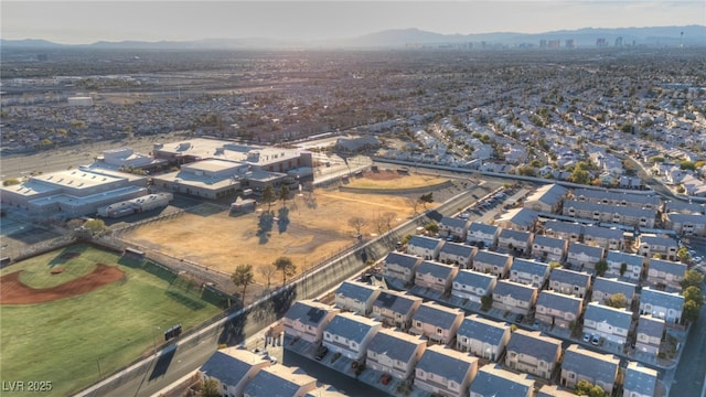 birds eye view of property featuring a mountain view