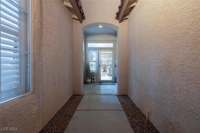 corridor with concrete flooring