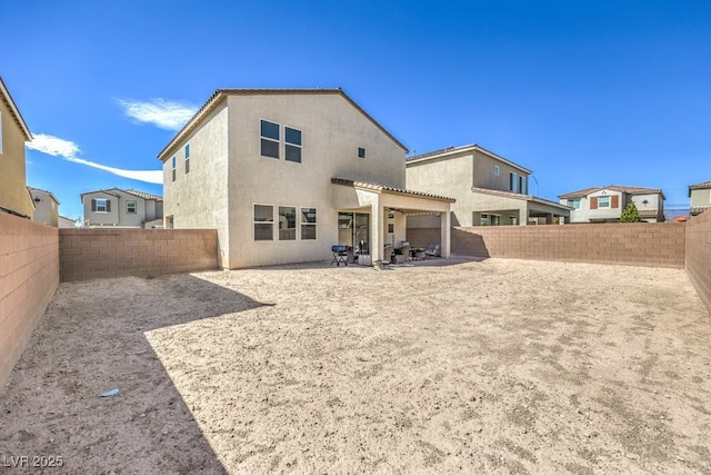 rear view of house with a patio