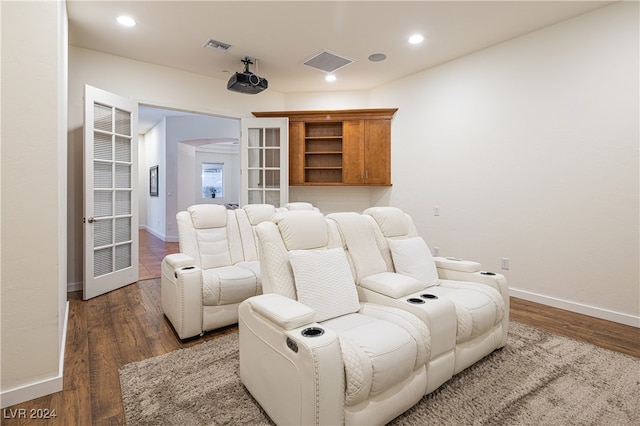 cinema with dark hardwood / wood-style flooring