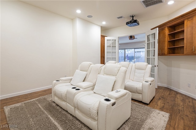 cinema room featuring french doors and dark hardwood / wood-style floors