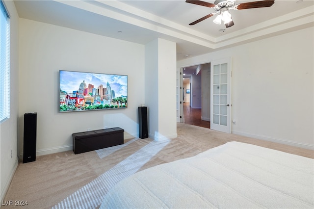 bedroom featuring light carpet, french doors, and ceiling fan