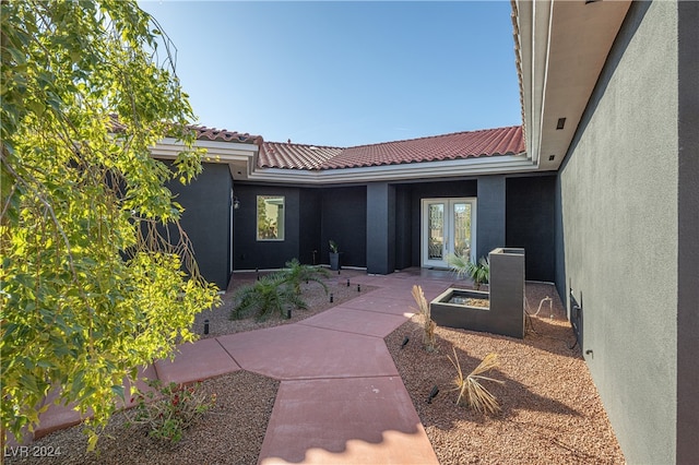 entrance to property featuring french doors