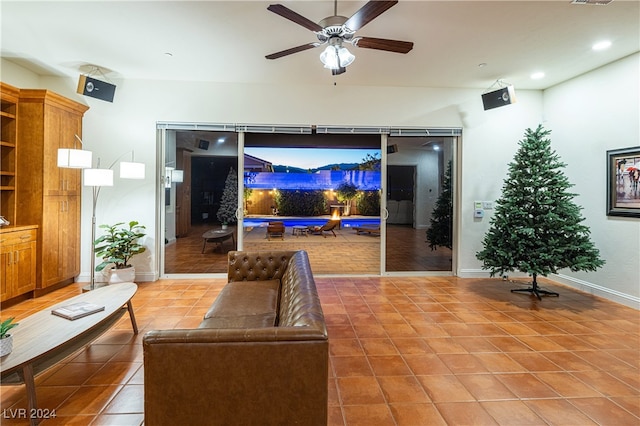 living room featuring tile patterned flooring and ceiling fan