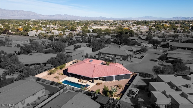 birds eye view of property with a mountain view