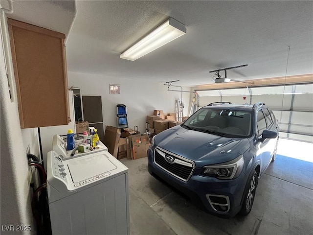 garage featuring washer / clothes dryer and a garage door opener