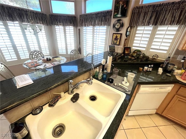 bathroom with tile patterned flooring and sink