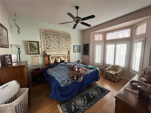 bedroom featuring wood-type flooring and ceiling fan