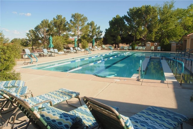 view of swimming pool with a patio