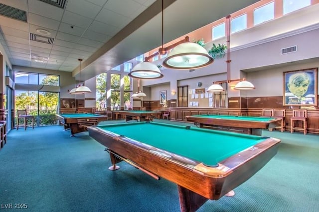 recreation room featuring carpet flooring, a drop ceiling, a high ceiling, and billiards