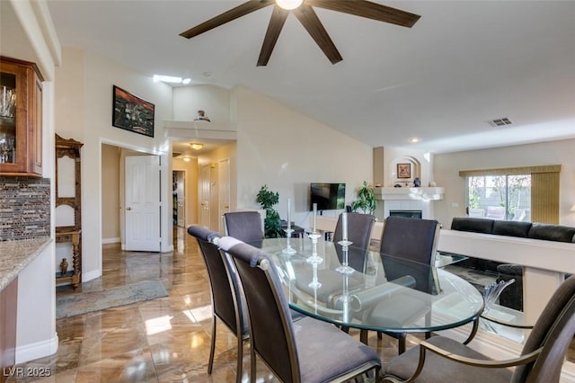 dining room featuring ceiling fan