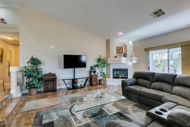 living room with a tiled fireplace