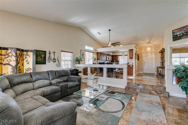 living room with vaulted ceiling and ceiling fan