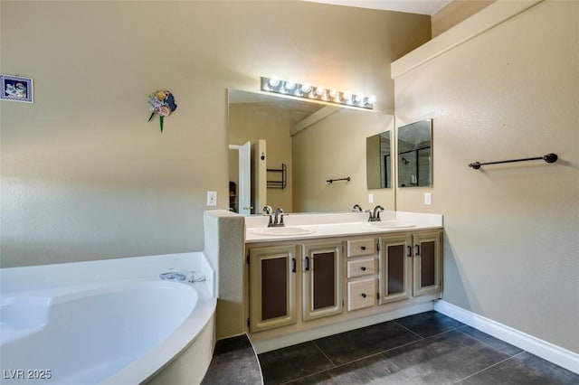 bathroom featuring tile patterned flooring, vanity, and a tub