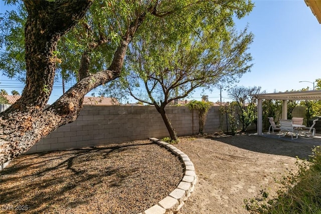 view of yard with a pergola and a patio area