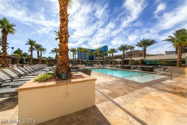 view of swimming pool featuring a patio