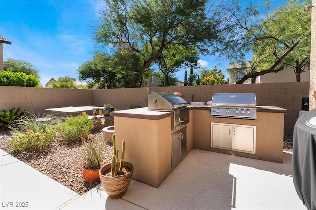 view of patio featuring grilling area and an outdoor kitchen