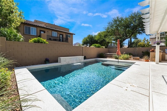 view of swimming pool with pool water feature