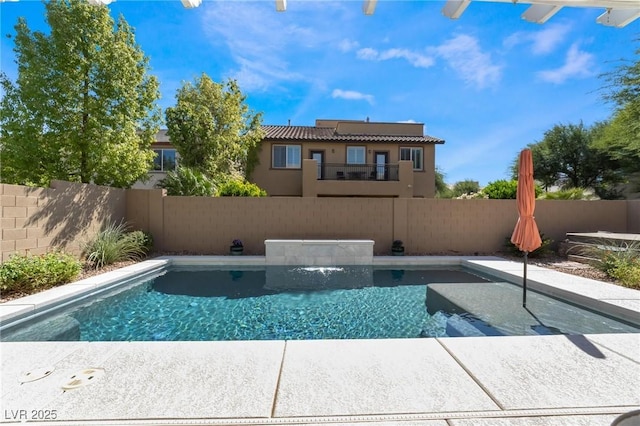 view of swimming pool with pool water feature