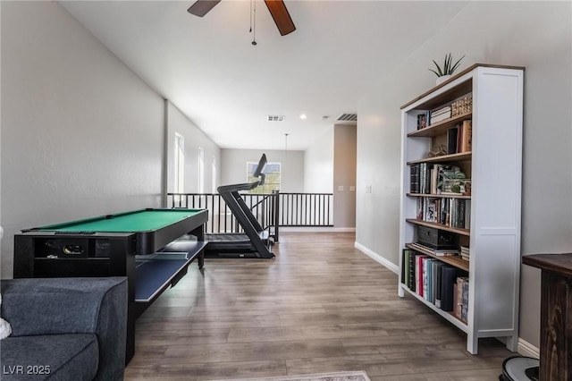 game room with hardwood / wood-style floors, ceiling fan, and billiards