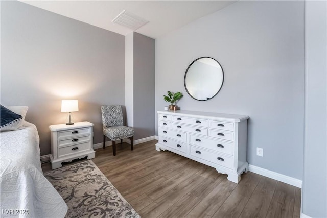 bedroom with dark wood-type flooring