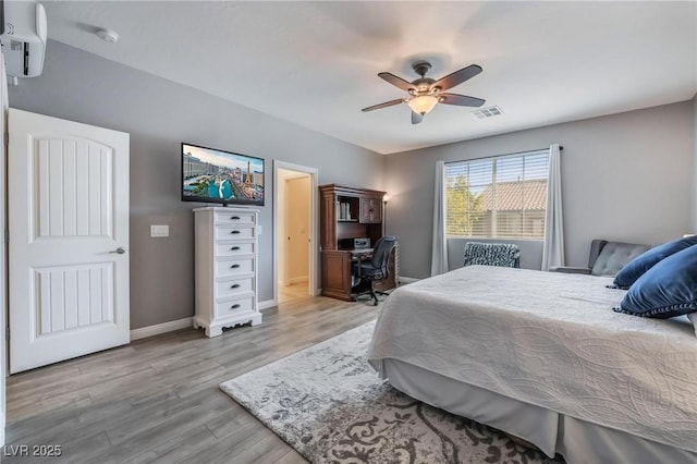 bedroom with light hardwood / wood-style flooring and ceiling fan