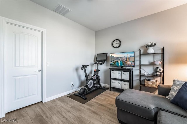 exercise area with hardwood / wood-style floors