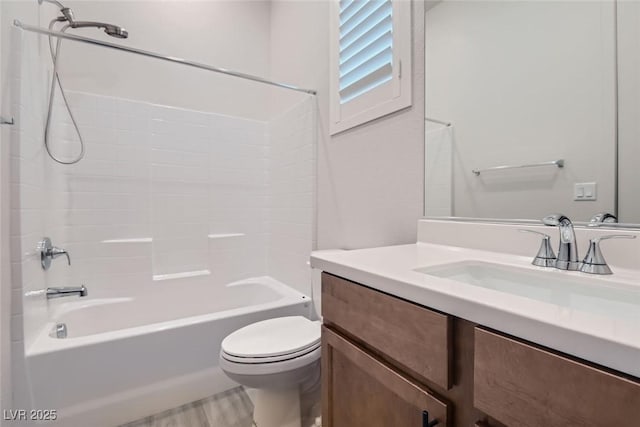 full bathroom with bathing tub / shower combination, hardwood / wood-style floors, vanity, and toilet