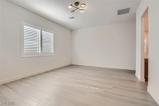 unfurnished room featuring light hardwood / wood-style flooring