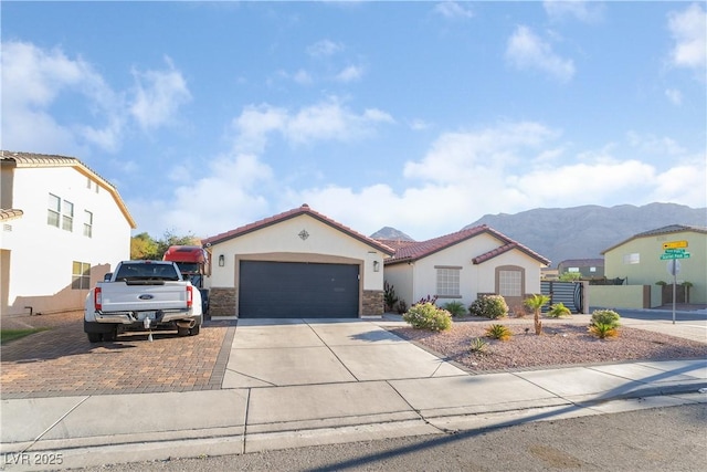 mediterranean / spanish-style house featuring a mountain view and a garage