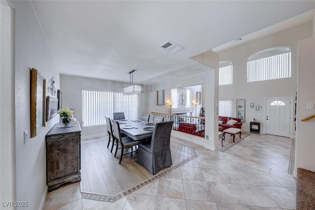 dining area featuring light tile patterned floors