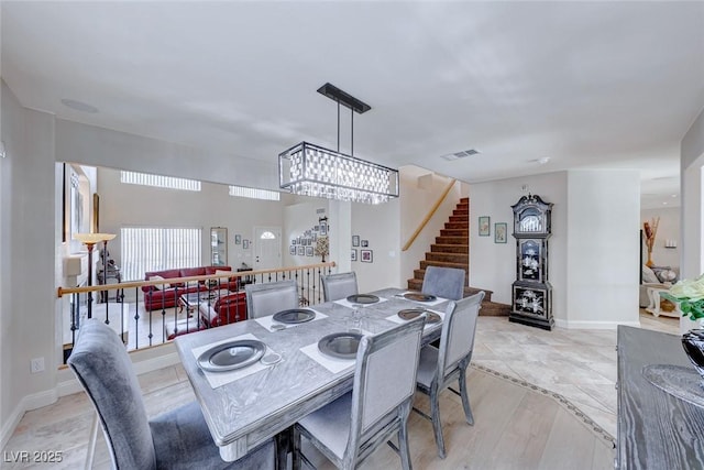 dining space featuring a chandelier