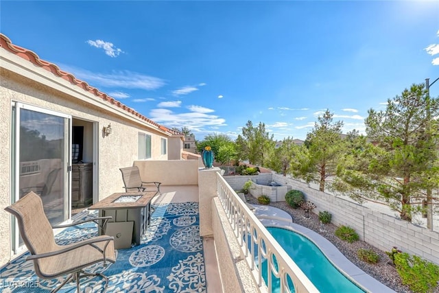 balcony featuring a fire pit