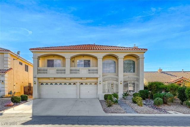 mediterranean / spanish home featuring a garage