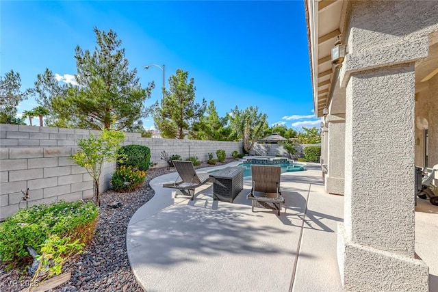 view of patio / terrace featuring a fenced in pool