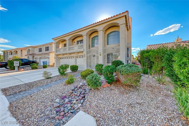 mediterranean / spanish house with a garage