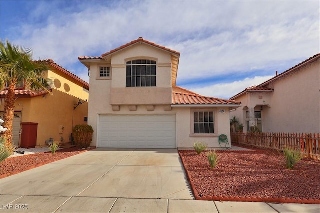 mediterranean / spanish house with a garage