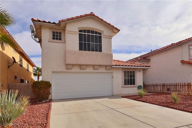 mediterranean / spanish-style home featuring a garage