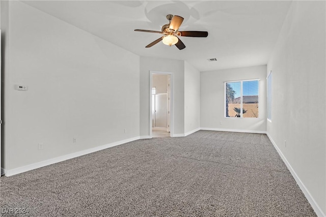 spare room with carpet and ceiling fan