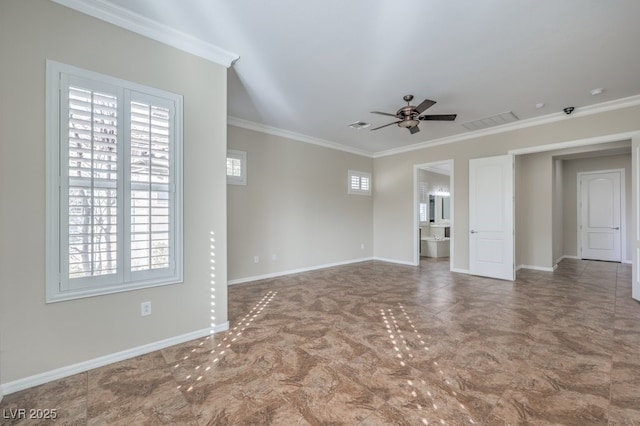 empty room featuring ceiling fan and ornamental molding