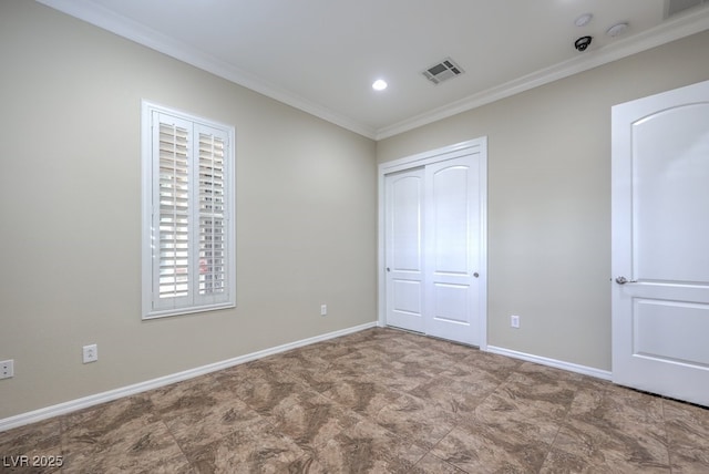 unfurnished bedroom with a closet and ornamental molding