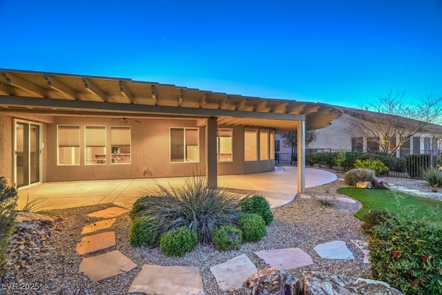 rear view of property featuring a patio area