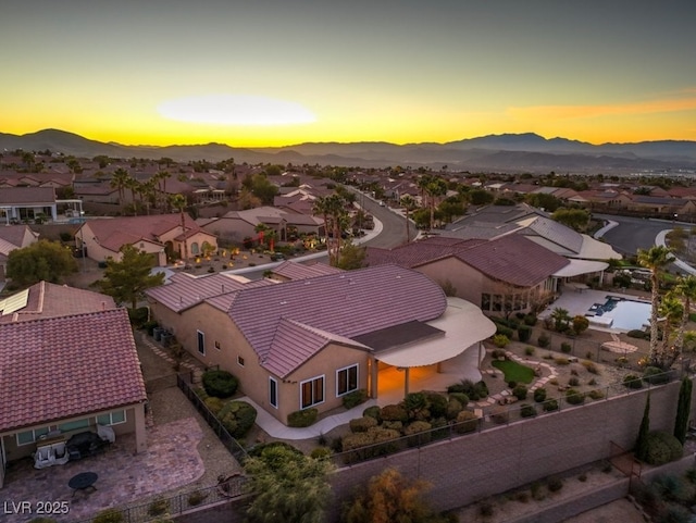 aerial view at dusk with a mountain view