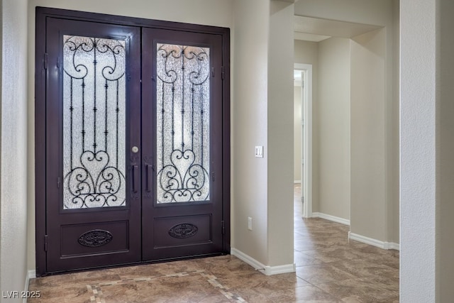 entrance foyer featuring french doors