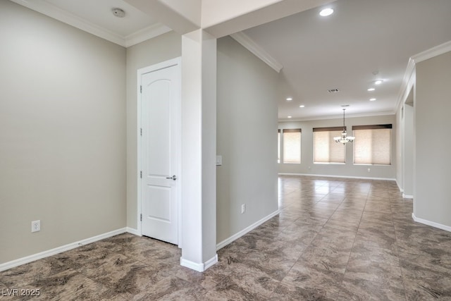 hall featuring crown molding and a chandelier